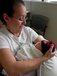 Nana holding my son Caleb for the first time.