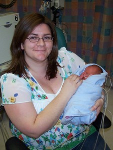 Carolyn holds her son for the first time at 4 days old