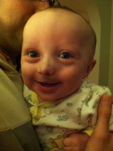 First smile 4 days post-lip repair/ 6 mths old.