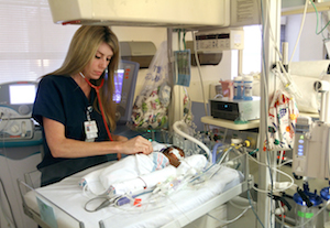 MUSC nurse practitioner, Stephanie Horecky Hall, RN, checks on one of her patients in the NICU, Kashmir Jones, who was born two months ago at 26 weeks. -- Photo by Sarah Pack, MUSC Public Relations