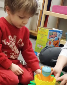 Carolyn's son plays a game during speech therapy.