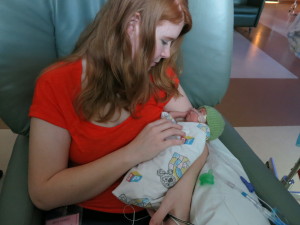 mom and preemie in NICU 