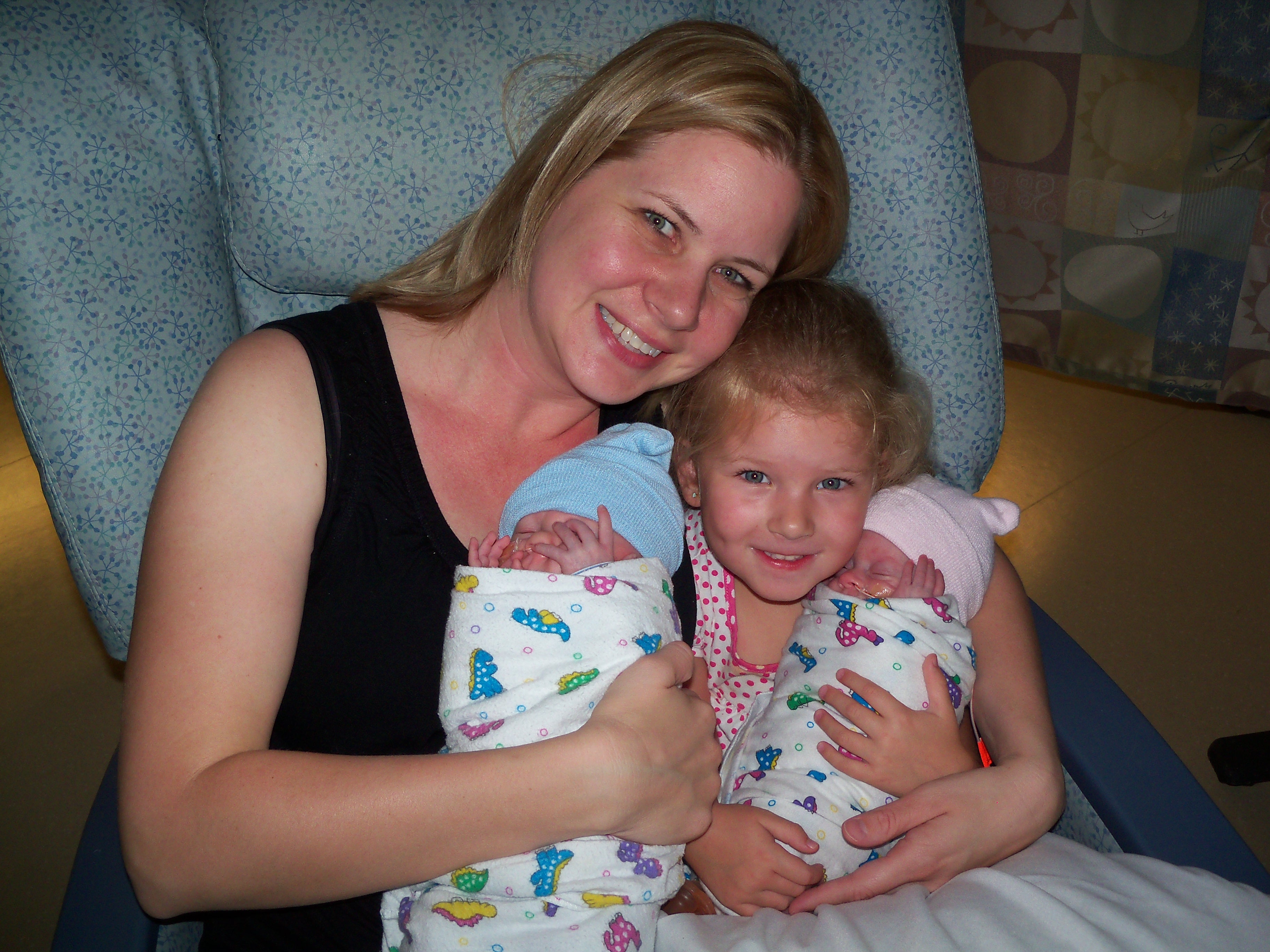 Holding my 3 yr old and 24 weekers in the NICU