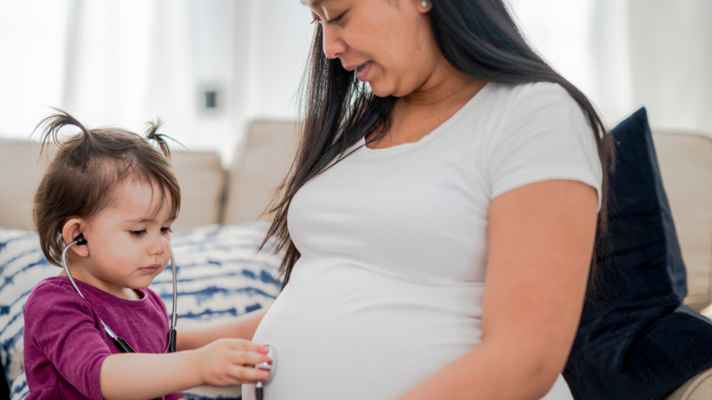 pregnancy after a NICU stay, hand to hold