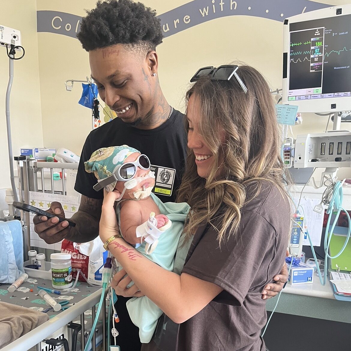 hand to hold, advocacy in the NICU, NICU family holding NICU baby