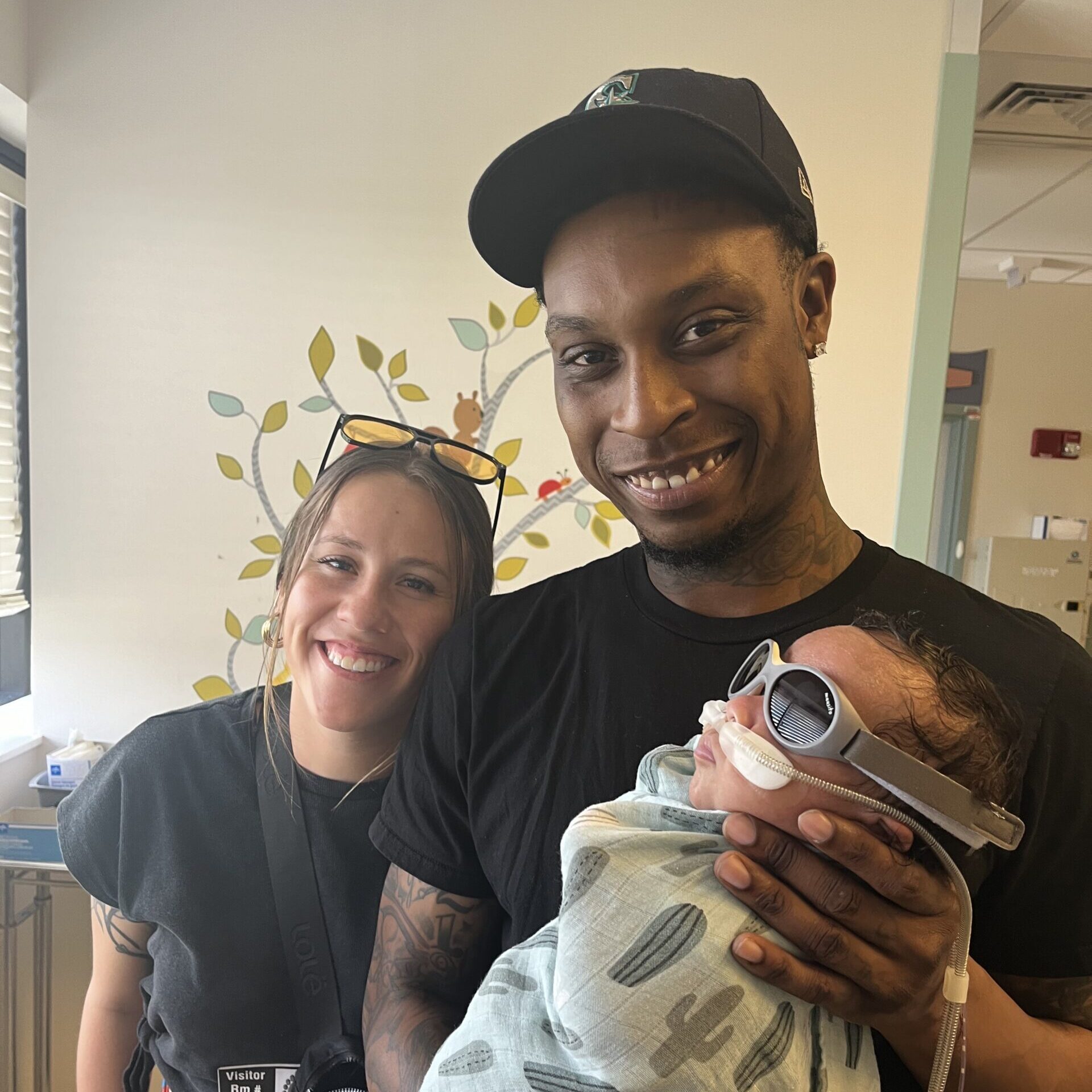 advocacy in the NICU, hand to hold, NICU family holding NICU baby