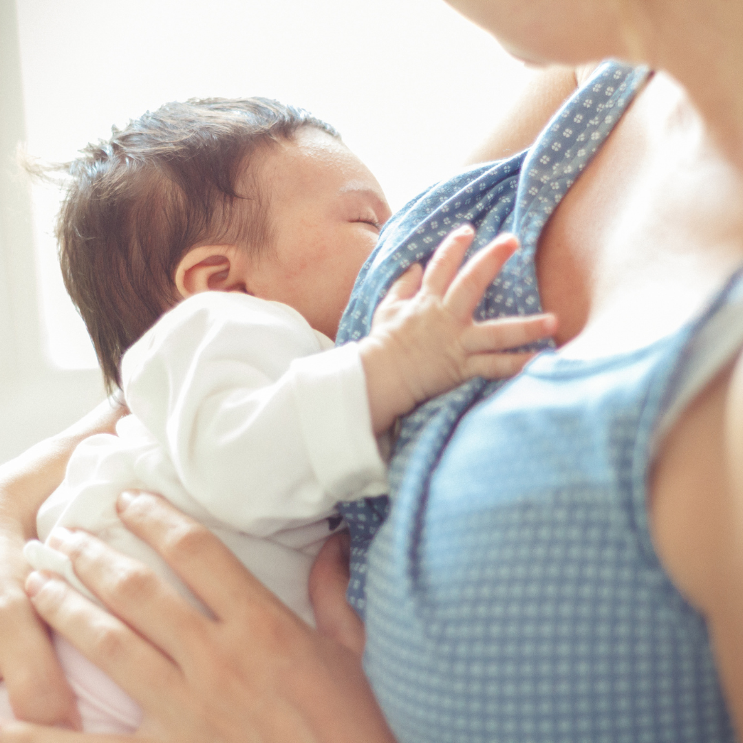 breastfeeding in the NICU, mom breastfeeding baby